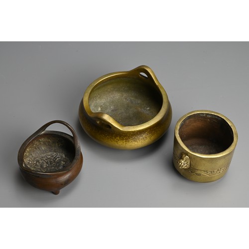 275 - THREE CHINESE BRONZE CENSERS, 19/20TH CENTURY. The largest of circular form with raised handles and ... 