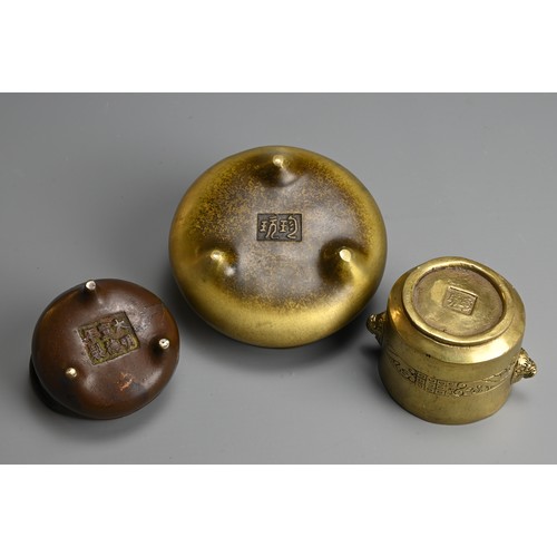 275 - THREE CHINESE BRONZE CENSERS, 19/20TH CENTURY. The largest of circular form with raised handles and ... 