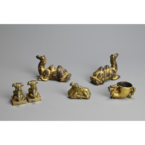 282 - A GROUP OF CHINESE POLISHED AND GILT BRONZE ITEMS. To include three gilt models of recumbent camels;... 