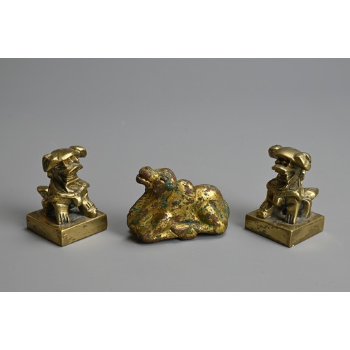 282 - A GROUP OF CHINESE POLISHED AND GILT BRONZE ITEMS. To include three gilt models of recumbent camels;... 