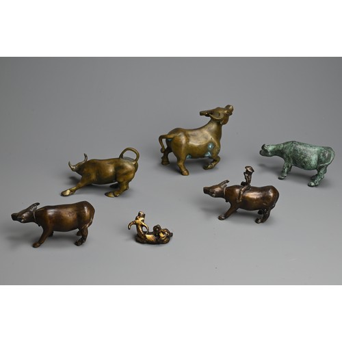 284 - A GROUP OF CHINESE BRONZE MODELS OF BUFFALO, 20TH  CENTURY. Of various sizes, two modelled with boys... 