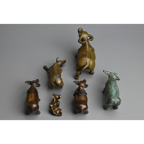 284 - A GROUP OF CHINESE BRONZE MODELS OF BUFFALO, 20TH  CENTURY. Of various sizes, two modelled with boys... 