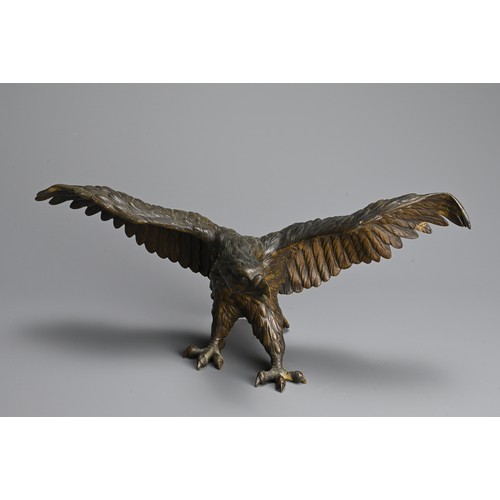 296 - A JAPANESE CAST BRONZE MODEL OF AN EAGLE, 19/20TH CENTURY. Well cast, standing with its wings spread... 