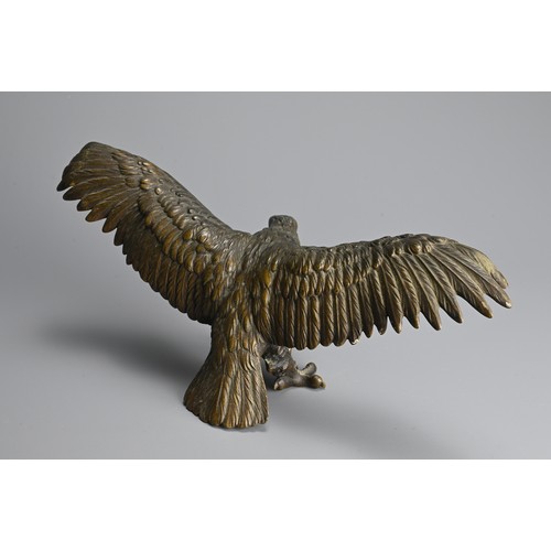 296 - A JAPANESE CAST BRONZE MODEL OF AN EAGLE, 19/20TH CENTURY. Well cast, standing with its wings spread... 