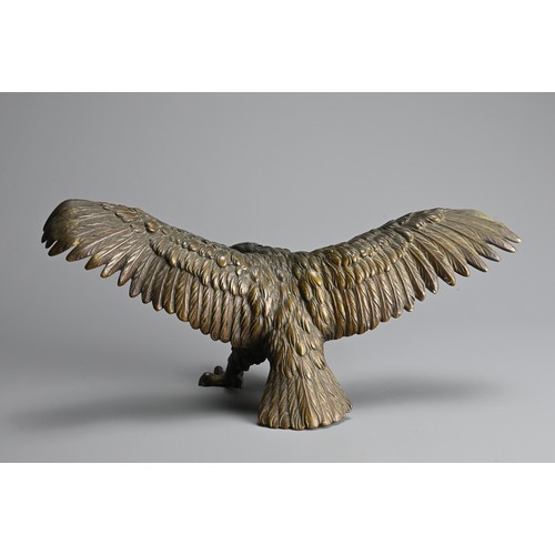 296 - A JAPANESE CAST BRONZE MODEL OF AN EAGLE, 19/20TH CENTURY. Well cast, standing with its wings spread... 