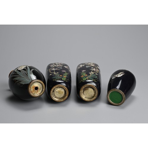 305 - A GROUP OF EARLY 20TH CENTURY JAPANESE CLOISONNE ENAMEL BLACK GROUND VASES. Comprising a pair of tap... 