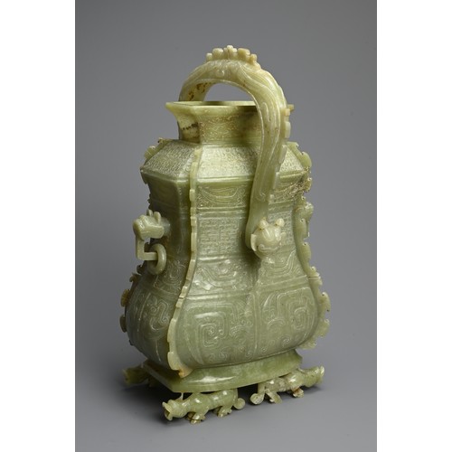 310 - A CHINESE ARCHAIC STYLE CARVED JADE VESSEL, 20TH CENTURY. Modelled on the early wine vessels, You, f... 