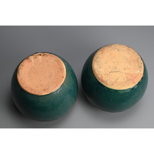 322 - A PAIR OF CHINESE TURQUOISE GLAZED STONEWARE JARS. Of globular form with moulded decoration around t... 