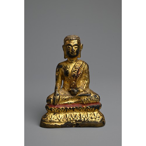 288 - A GOLD LACQUERED BRONZE FIGURE OF BUDDHA, 19TH CENTURY. Seated on a lotus base wearing a dhoti decor... 