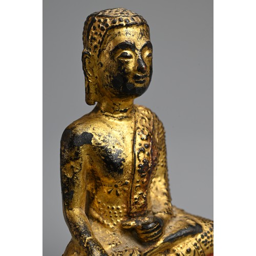 288 - A GOLD LACQUERED BRONZE FIGURE OF BUDDHA, 19TH CENTURY. Seated on a lotus base wearing a dhoti decor... 