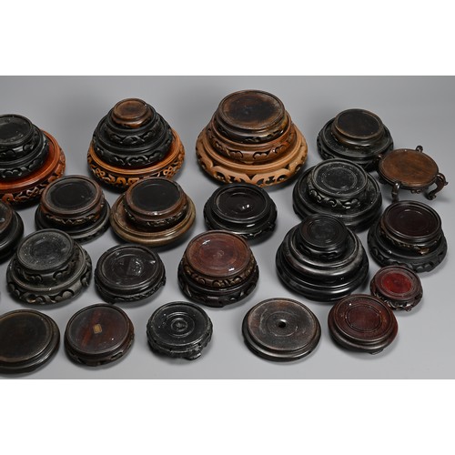 347 - A QUANTITY OF CHINESE WOOD DISPLAY STANDS, MAINLY 20TH CENTURY. All or circular form. Inner diameter... 