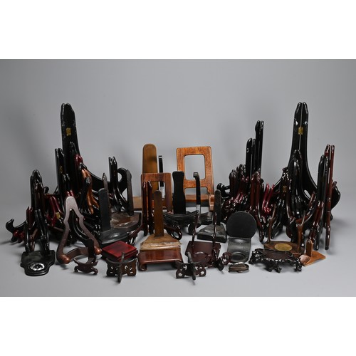 350 - A QUANTITY OF CHINESE WOOD DISPLAY STANDS. To include fifty eight folding plate stands, together wit... 