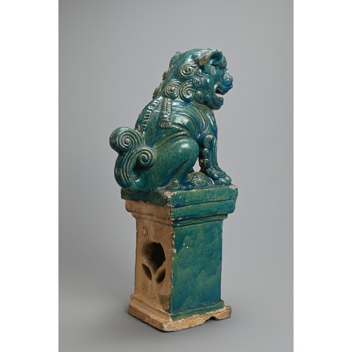 330 - A LARGE CHINESE TURQUOISE GLAZED STONEWARE GUARDIAN LION, MING / QING DYNASTY. The lion seated on a ... 