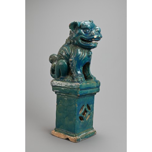 330 - A LARGE CHINESE TURQUOISE GLAZED STONEWARE GUARDIAN LION, MING / QING DYNASTY. The lion seated on a ... 