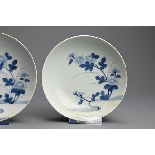 367 - A PAIR OF JAPANESE NABESHIMA BLUE AND WHITE PORCELAIN DISHES, 19TH CENTURY. Each painted with flower... 