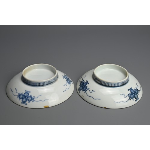 367 - A PAIR OF JAPANESE NABESHIMA BLUE AND WHITE PORCELAIN DISHES, 19TH CENTURY. Each painted with flower... 