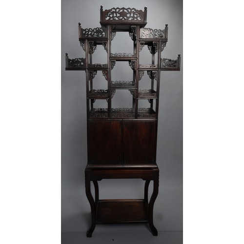 339 - A TALL CHINESE HARDWOOD INLAID DECORATED DISPLAY CABINET, EARLY 20TH CENTURY. In two sections compri... 