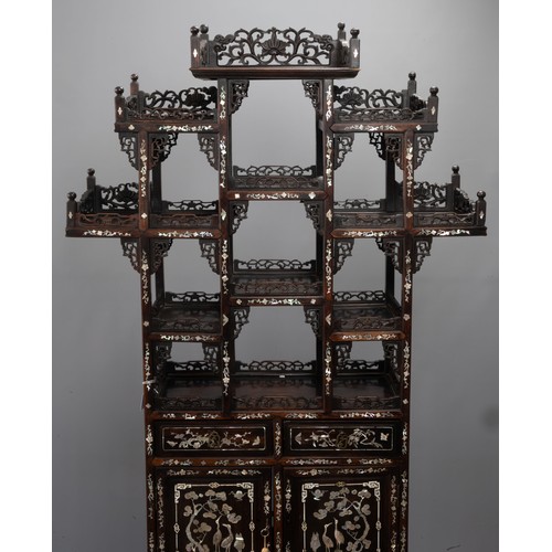 339 - A TALL CHINESE HARDWOOD INLAID DECORATED DISPLAY CABINET, EARLY 20TH CENTURY. In two sections compri... 