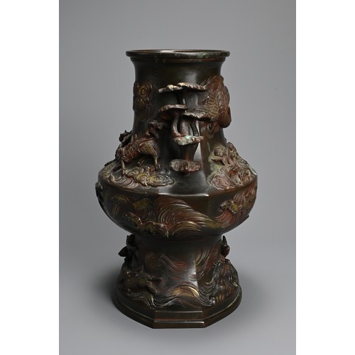 375 - A JAPANESE BRONZE TWO-HANDLED BALUSTER VASE, LATE MEIJI PERIOD (1868-1912). With pierced foliate han... 