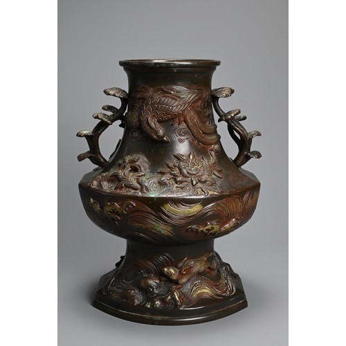 375 - A JAPANESE BRONZE TWO-HANDLED BALUSTER VASE, LATE MEIJI PERIOD (1868-1912). With pierced foliate han... 