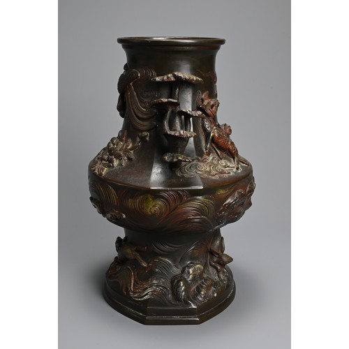 375 - A JAPANESE BRONZE TWO-HANDLED BALUSTER VASE, LATE MEIJI PERIOD (1868-1912). With pierced foliate han... 