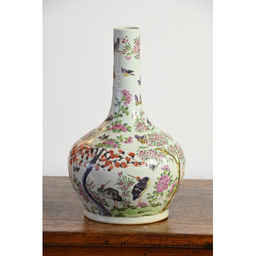 37 - A CHINESE FAMILLE ROSE PORCELAIN BOTTLE VASE, 19TH CENTURY. A globular body with cylindrical neck de... 