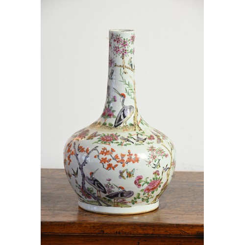 38 - A CHINESE FAMILLE ROSE PORCELAIN BOTTLE VASE, 19TH CENTURY. A globular body with cylindrical neck de... 