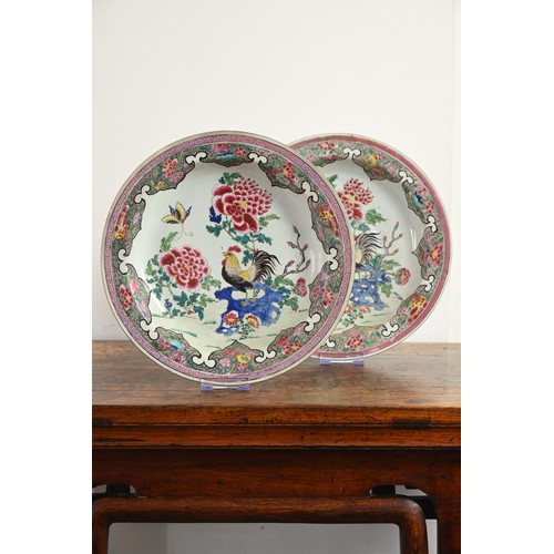 50 - A LARGE PAIR OF CHINESE FAMILLE ROSE PORCELAIN ROOSTER DISHES, EARLY 18TH CENTURY. With rounded side... 