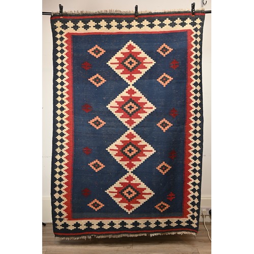 336 - AN AFGHAN FLATWEAVE KILIM RUG, 20TH CENTURY. Woven with bold diamond lozenges within a geometric bor... 