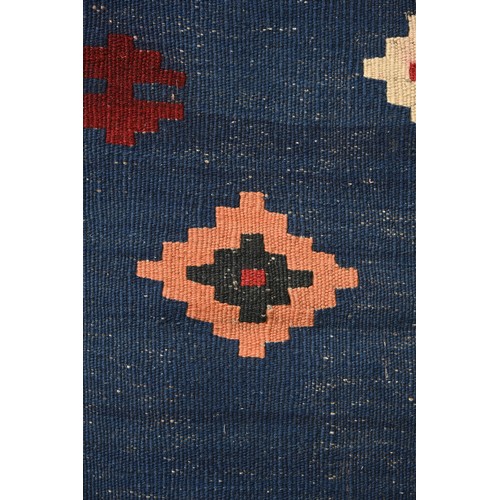 336 - AN AFGHAN FLATWEAVE KILIM RUG, 20TH CENTURY. Woven with bold diamond lozenges within a geometric bor... 