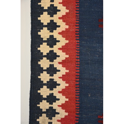 336 - AN AFGHAN FLATWEAVE KILIM RUG, 20TH CENTURY. Woven with bold diamond lozenges within a geometric bor... 