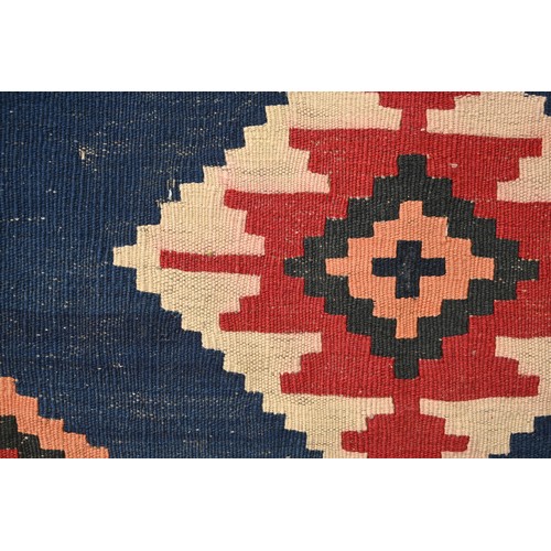 336 - AN AFGHAN FLATWEAVE KILIM RUG, 20TH CENTURY. Woven with bold diamond lozenges within a geometric bor... 