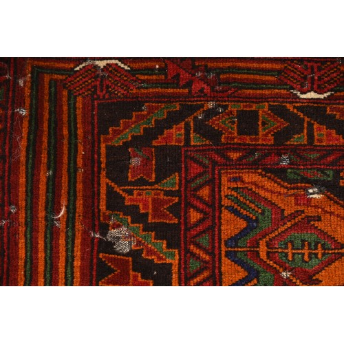 337 - AN AFGHAN CAMEL WOOL RUG, 20TH CENTURY. With geometric roundels enclosing foliate motifs predominate... 