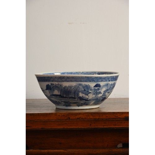 60 - A LARGE CHINESE BLUE AND WHITE PORCELAIN BOWL, 19TH CENTURY. Decorated with figures on a bridge in a... 