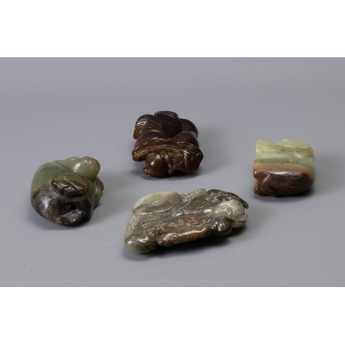 319 - FOUR CHINESE CARVED JADE ITEMS, of different forms to include Liu Hai, recumbent lion with butterfly... 