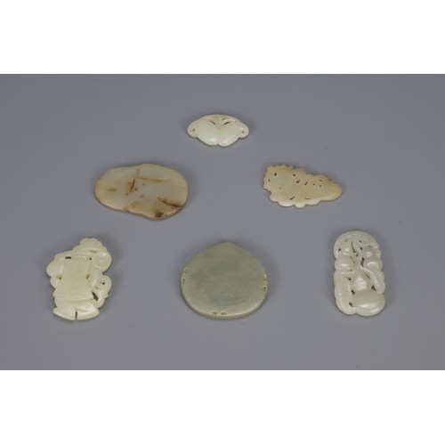 314 - SIX CHINESE CARVED PALE CELADON JADE PENDANTS, of different forms to include hanging double-gourds, ... 