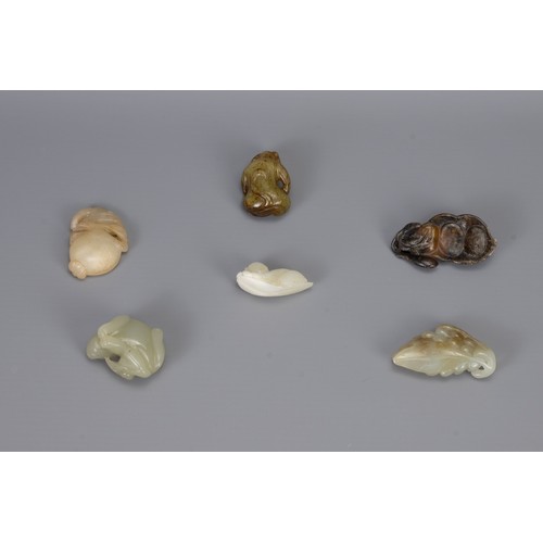 315 - SIX CHINESE CARVED JADE PENDANTS, of different forms to include a bunch of grapes, monkey, boy resti... 