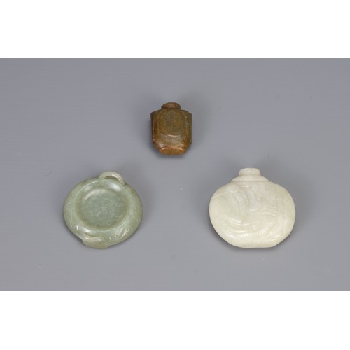 318 - THREE CHINESE CARVED JADE ITEMS, to include two snuff bottles and one brush washer in the form of a ... 