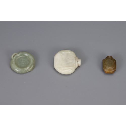 318 - THREE CHINESE CARVED JADE ITEMS, to include two snuff bottles and one brush washer in the form of a ... 