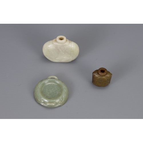 318 - THREE CHINESE CARVED JADE ITEMS, to include two snuff bottles and one brush washer in the form of a ... 