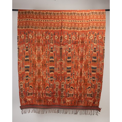 243 - TWO 20TH CENTURY INDONESIAN (SUMBA) COTTON IKAT HINGGI. Each woven with stylised reptiles and figure... 