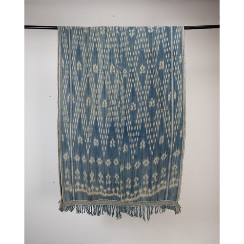 239 - FOUR 20TH CENTURY INDONESIAN (SUMBA) COTTON IKAT HINGGI IN SIZES. Comprising: an example with stylis... 