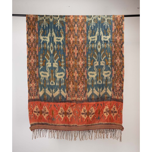 239 - FOUR 20TH CENTURY INDONESIAN (SUMBA) COTTON IKAT HINGGI IN SIZES. Comprising: an example with stylis... 