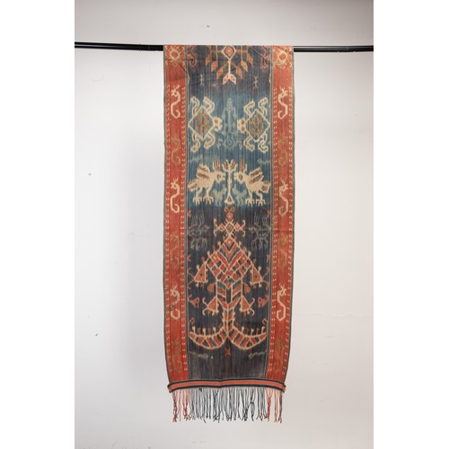 239 - FOUR 20TH CENTURY INDONESIAN (SUMBA) COTTON IKAT HINGGI IN SIZES. Comprising: an example with stylis... 