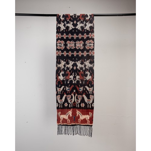 242 - A GROUP OF 20TH CENTURY INDONESIAN TEXTILES. Comprising: a small Sumba cotton ikat, woven with birds... 