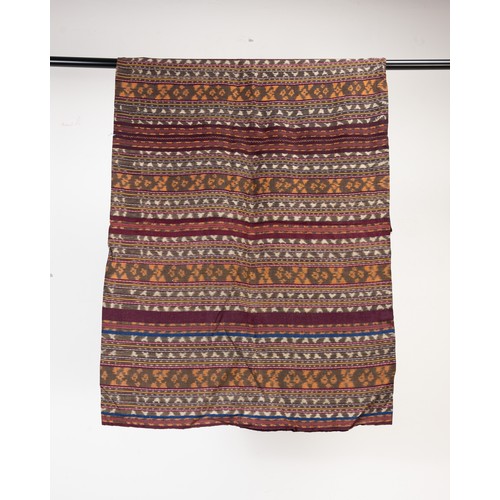 242 - A GROUP OF 20TH CENTURY INDONESIAN TEXTILES. Comprising: a small Sumba cotton ikat, woven with birds... 