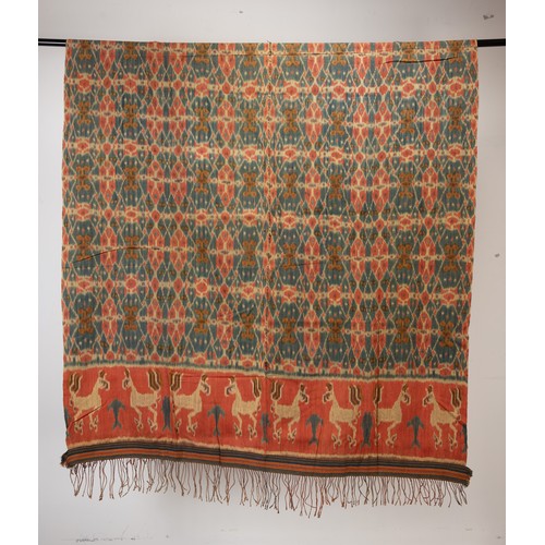 239 - FOUR 20TH CENTURY INDONESIAN (SUMBA) COTTON IKAT HINGGI IN SIZES. Comprising: an example with stylis... 