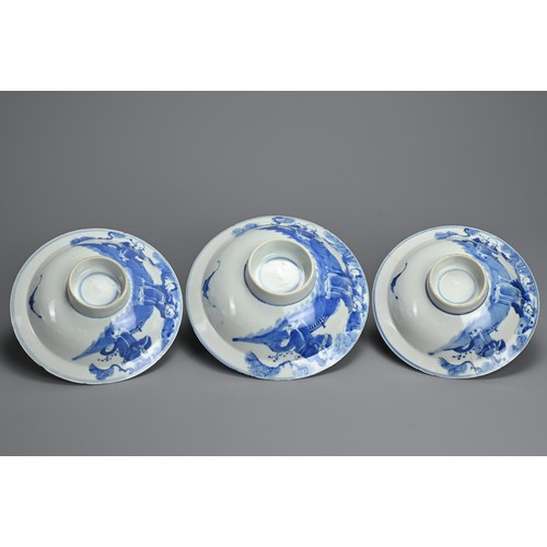 1 - THREE CHINESE BLUE AND WHITE BOWLS, 19TH CENTURY. Shallow rounded sides on a raised foot with everte... 