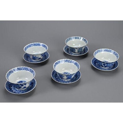 21 - A SET OF TEN CHINESE BLUE AND WHITE PORCELAIN CUPS AND SAUCERS, LATE QING DYNASTY. Ten lobed cups an... 