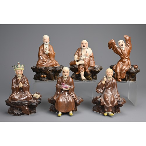 41 - A RARE SET OF CHINESE PAINTED AND ENAMELLED BISCUIT PORCELAIN LUOHAN FIGURES, ATTRIBUTED TO ZENG LON... 